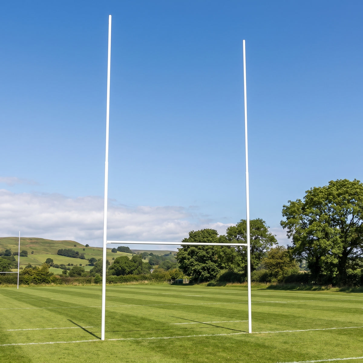 12m socketed aluminium rugby posts in white on a grass rugby pitch