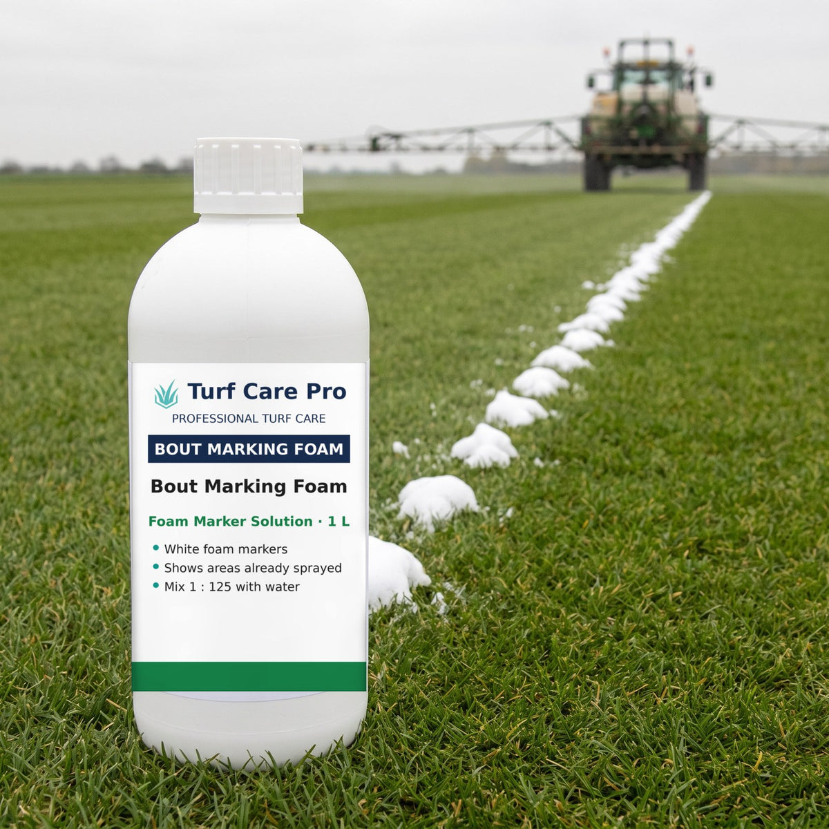 1L bout marking foam solution on turf beside a line of white foam markers left by a boom sprayer