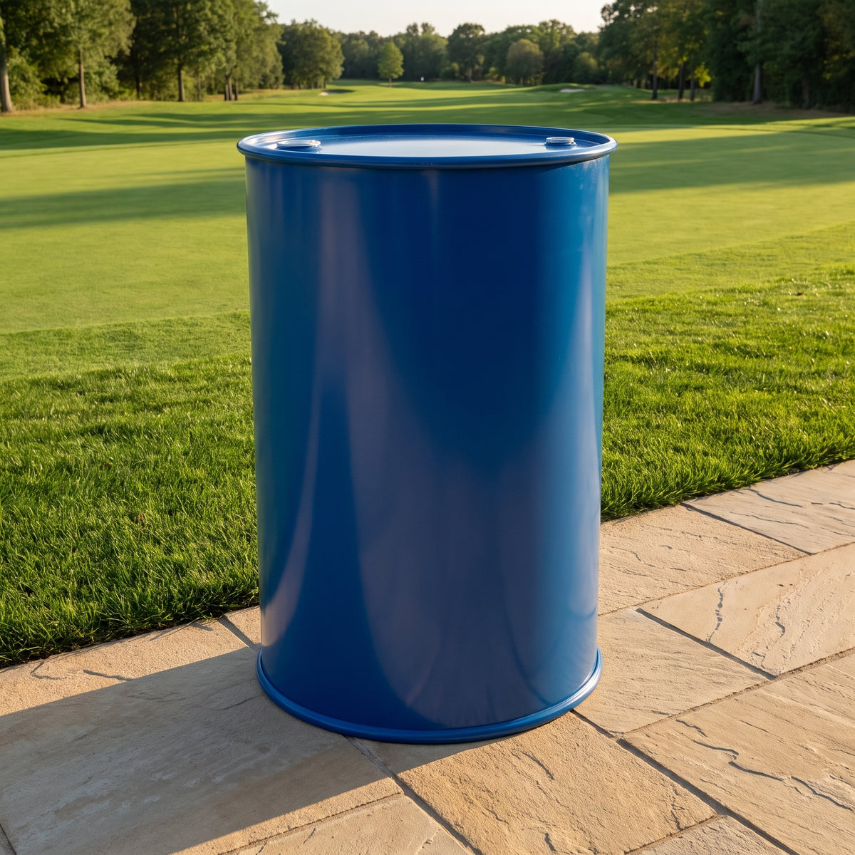Fast-acting liquid iron for turf 200L drum beside a golf fairway