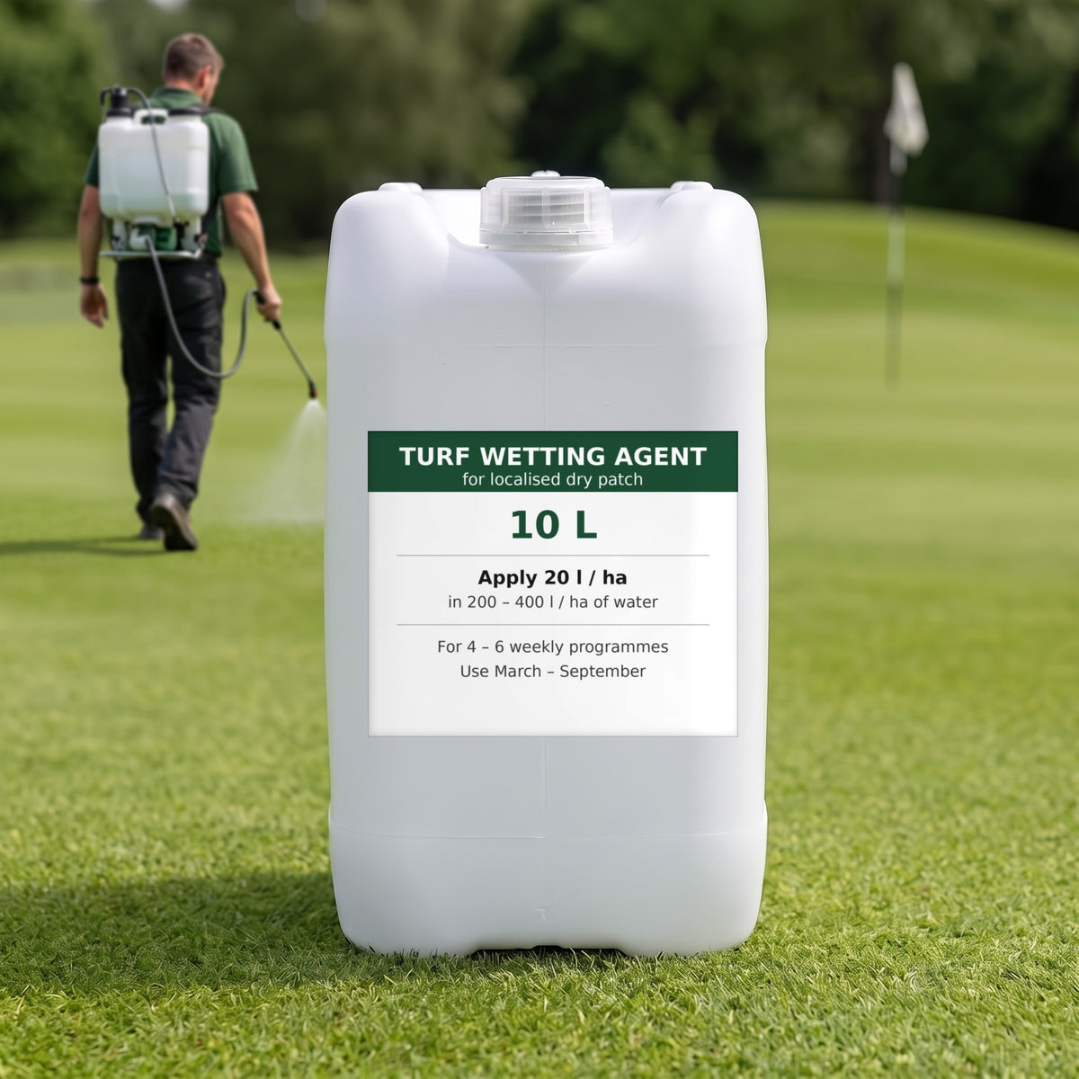 Liquid turf wetting agent 10L on a golf green while a greenkeeper sprays with a knapsack sprayer