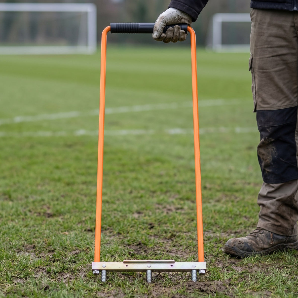 Turf aeration and drainage fork supplied without tines, on a football pitch